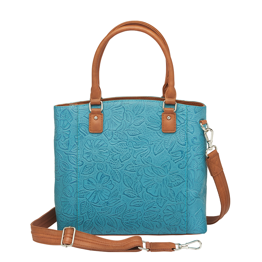Teal and brown Town Tote concealed carry bag in tooled cowhide leather – spacious CCW compartment, durable design with adjustable shoulder strap, fits compact firearms, GTM-51