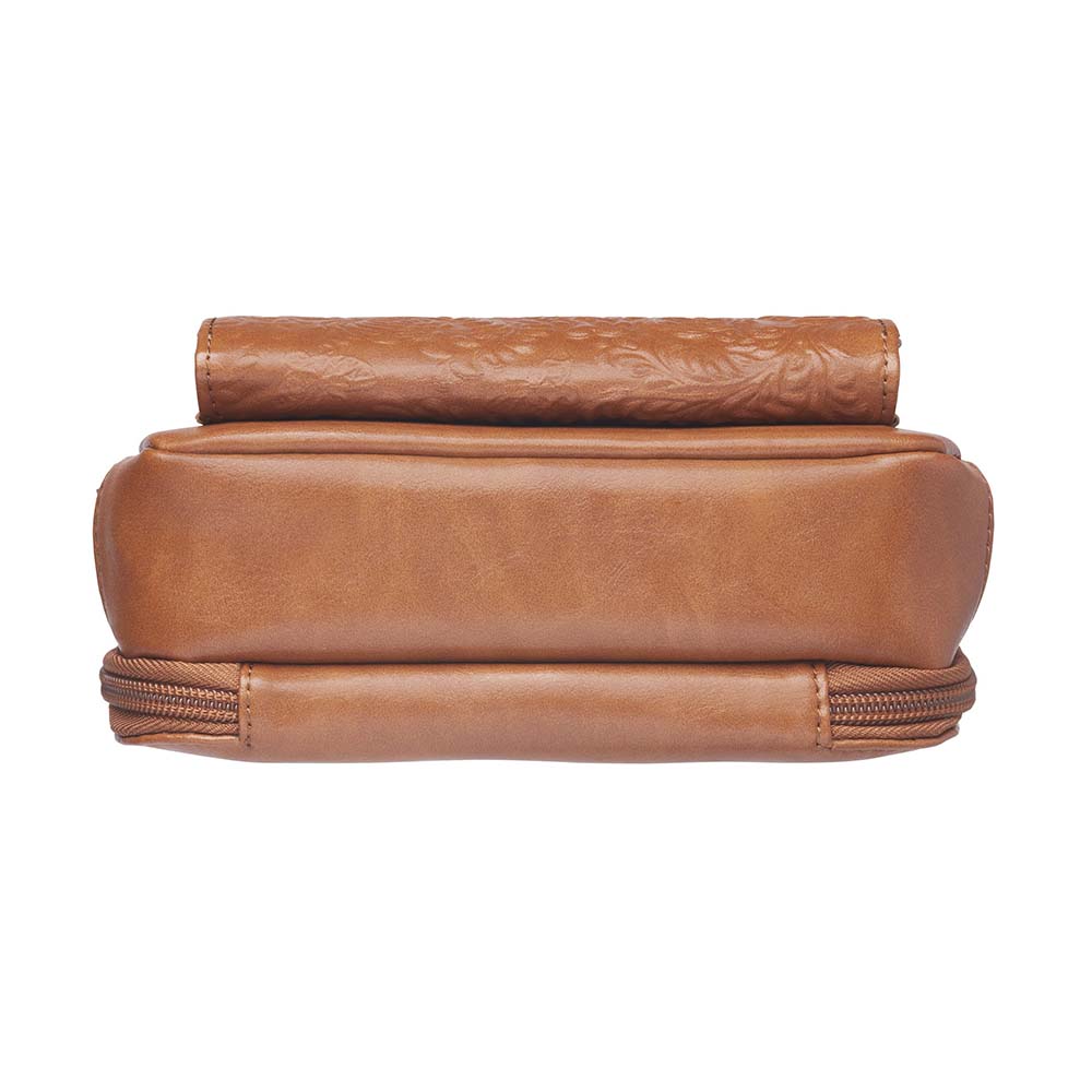 Tan concealed carry crossbody purse in washable American cowhide leather with RFID wallet organizer, slash-resistant steel cable strap, secure magnetic flap, triple-zippered gun access for compact firearms like Ruger LCP and Kahr 9, perfect for women seeking discreet protection and clean styling.