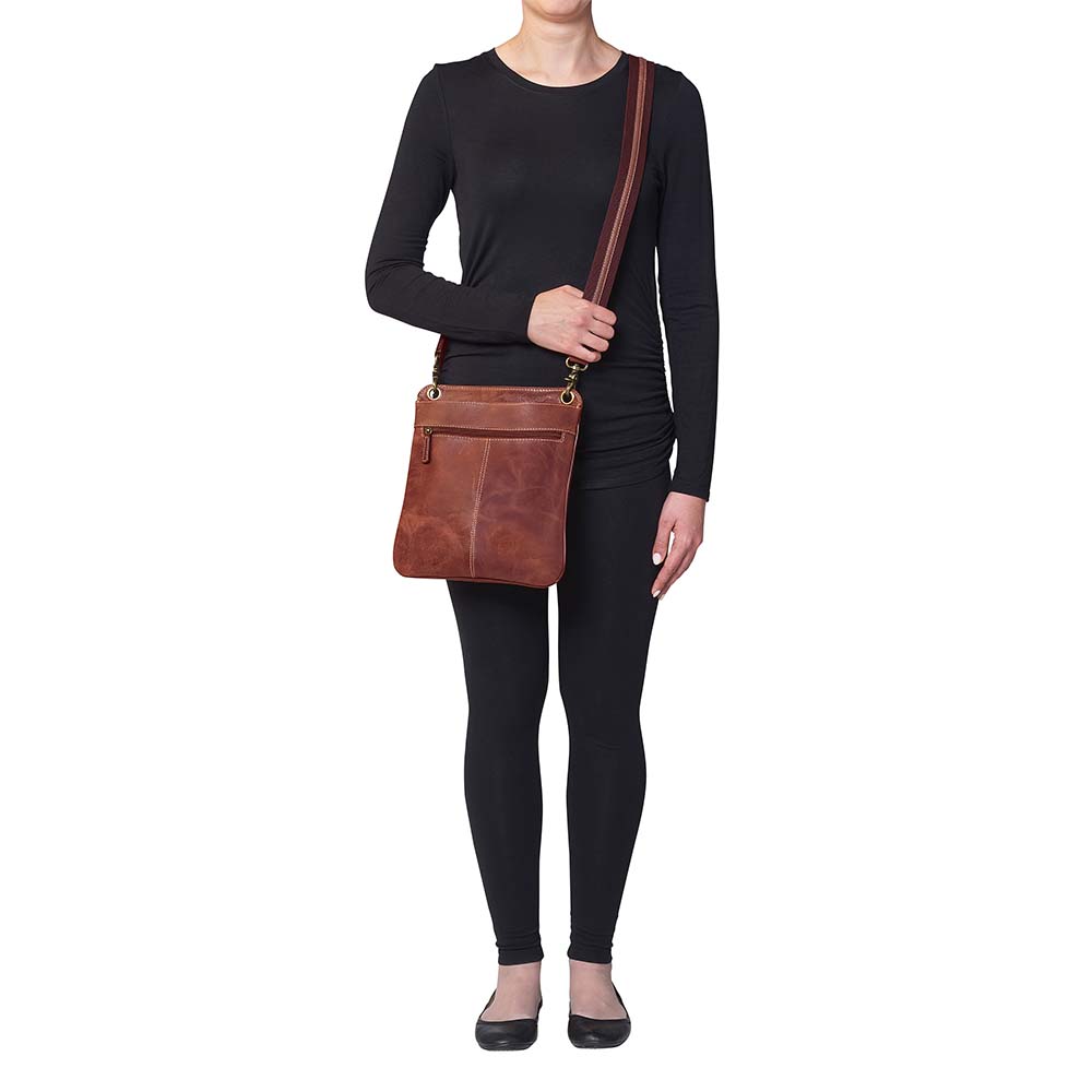 Vintage distressed buffalo leather concealed carry crossbody purse with adjustable slash-resistant strap, left and right-handed access, and a secure gun compartment designed for fast draw. Includes holster and fits compact handguns like S&W Shield, Ruger LCP, and Glock 42.