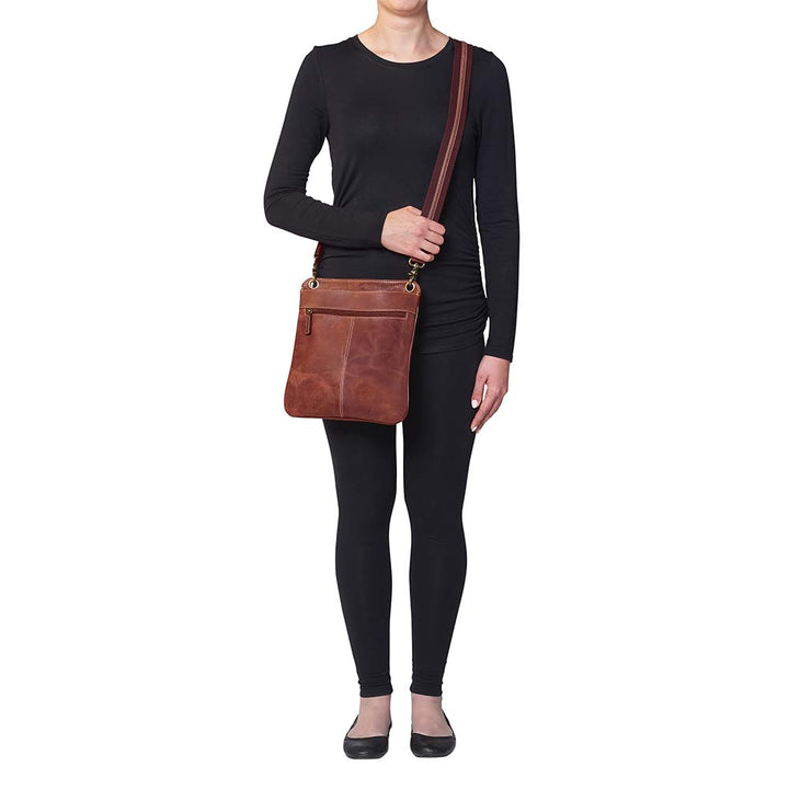 Vintage distressed buffalo leather concealed carry crossbody purse with adjustable slash-resistant strap, left and right-handed access, and a secure gun compartment designed for fast draw. Includes holster and fits compact handguns like S&W Shield, Ruger LCP, and Glock 42.