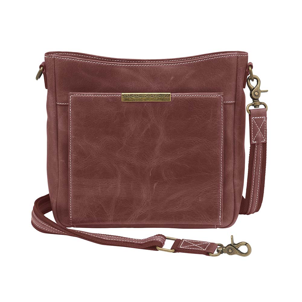 Red distressed leather Gun Tote'N Mamas slim crossbody concealed carry purse with shoulder strap and front design.
