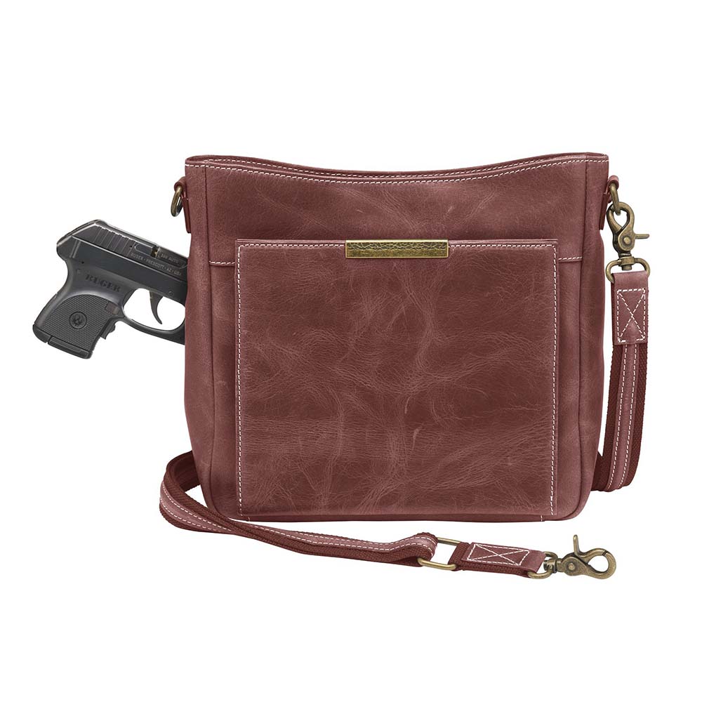 Red distressed leather concealed carry crossbody purse with RFID-secured card slots, top-draw access for right or left hand, fits compact pistols like Glock 26 or HK VP9, slash-resistant adjustable strap.