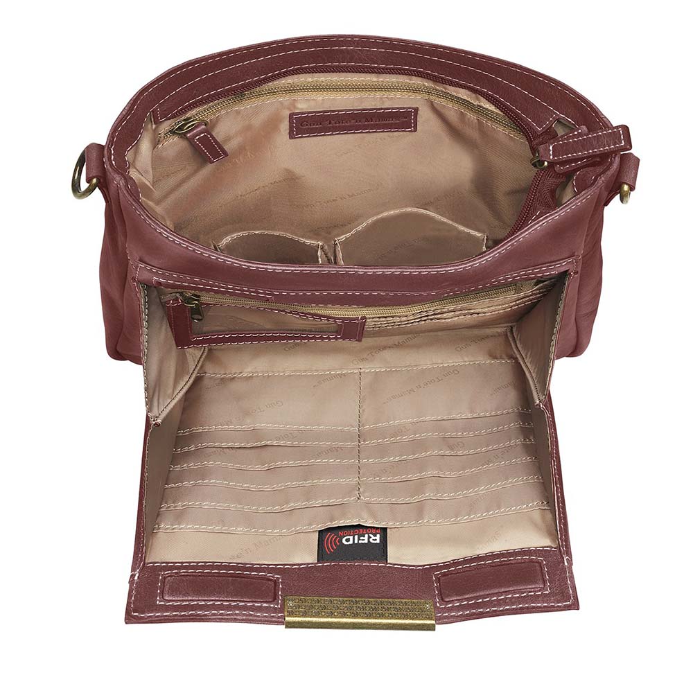 Red distressed leather concealed carry crossbody purse with RFID-secured card slots, top-draw access for right or left hand, fits compact pistols like Glock 26 or HK VP9, slash-resistant adjustable strap.