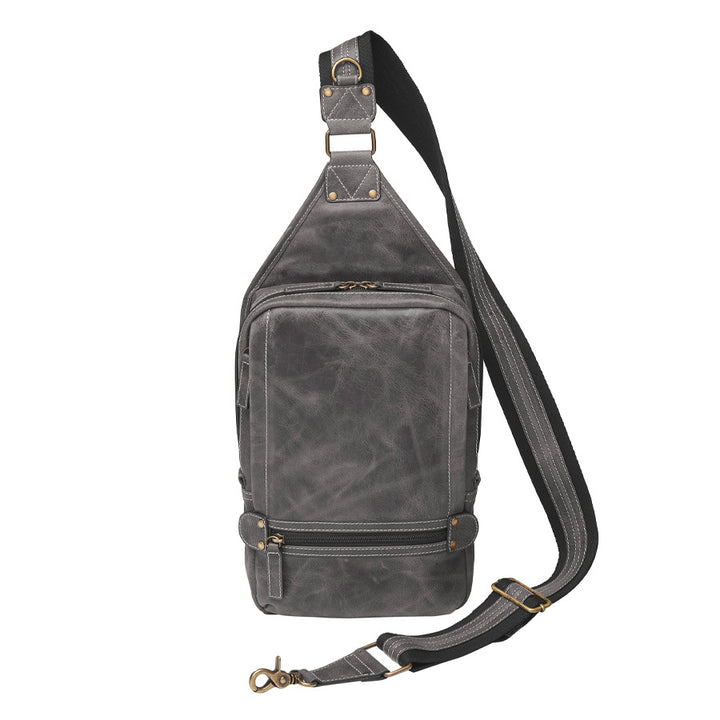 Distressed gray buffalo leather sling concealed carry from front backpack with tactical organization, RFID zip pocket, padded holster compartment for Glock 19, Sig P320, and HK VP9, slash-proof strap, and swing-front crossbody design with 3 exterior zip pockets and morale patch zone